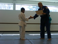 Handing out yellow belt certificate